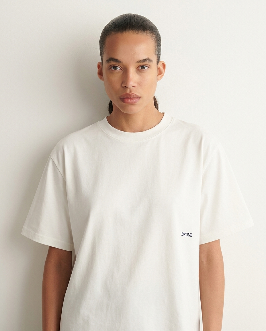 Close-up of Brune white typo tee worn by a model